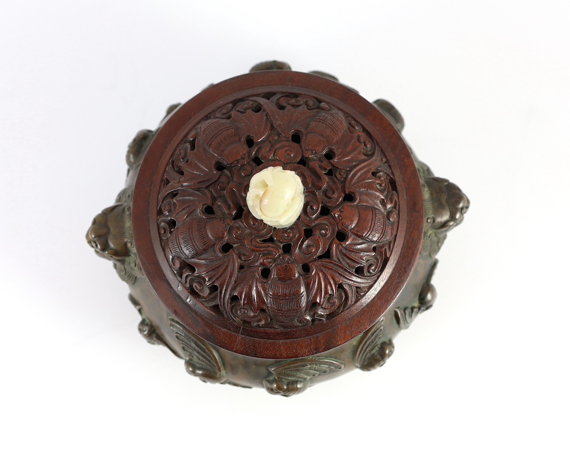A large Chinese bronze ding censer, the wood cover with pale celadon jade finial, 22cm across
